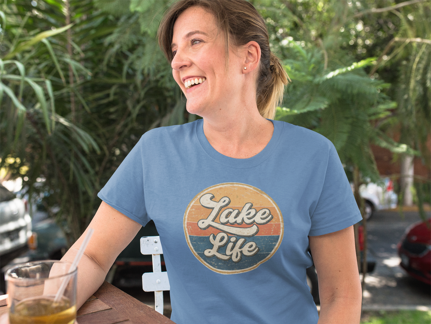 Woman wearing a 'Lake Life' t-shirt outdoors