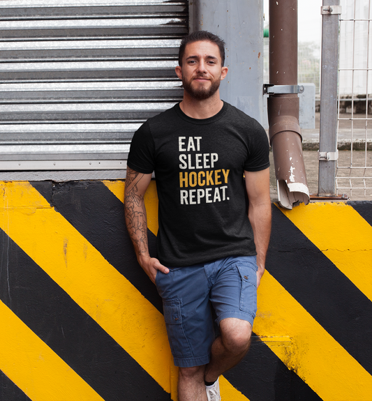 Man showcasing Eat Sleep Hockey Repeat T-Shirt in relaxed street style pose