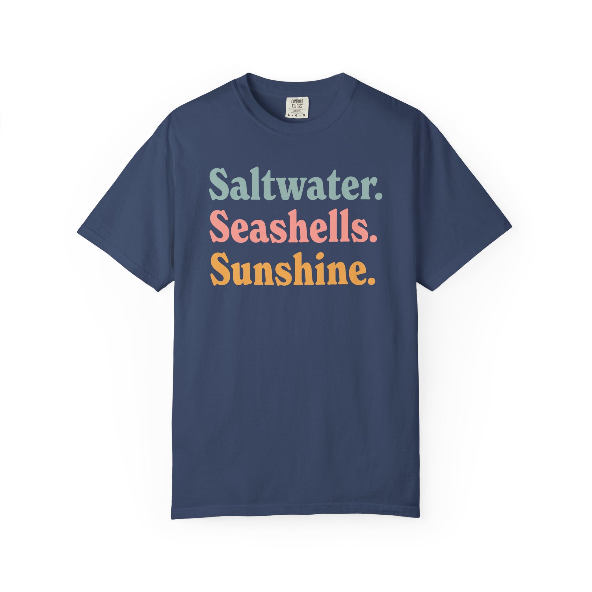 China blue Comfort Colors t-shirt with colorful text 'Saltwater. Seashells. Sunshine.' on a white background