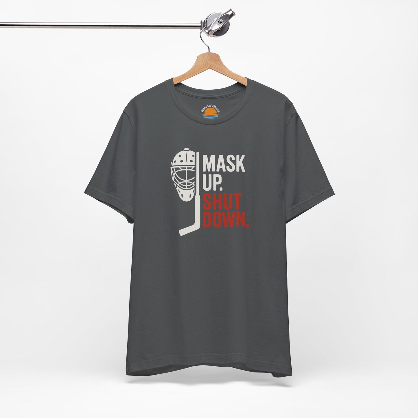 Asphalt t-shirt with Mask Up Shut Down text with goalie mask design on a white background