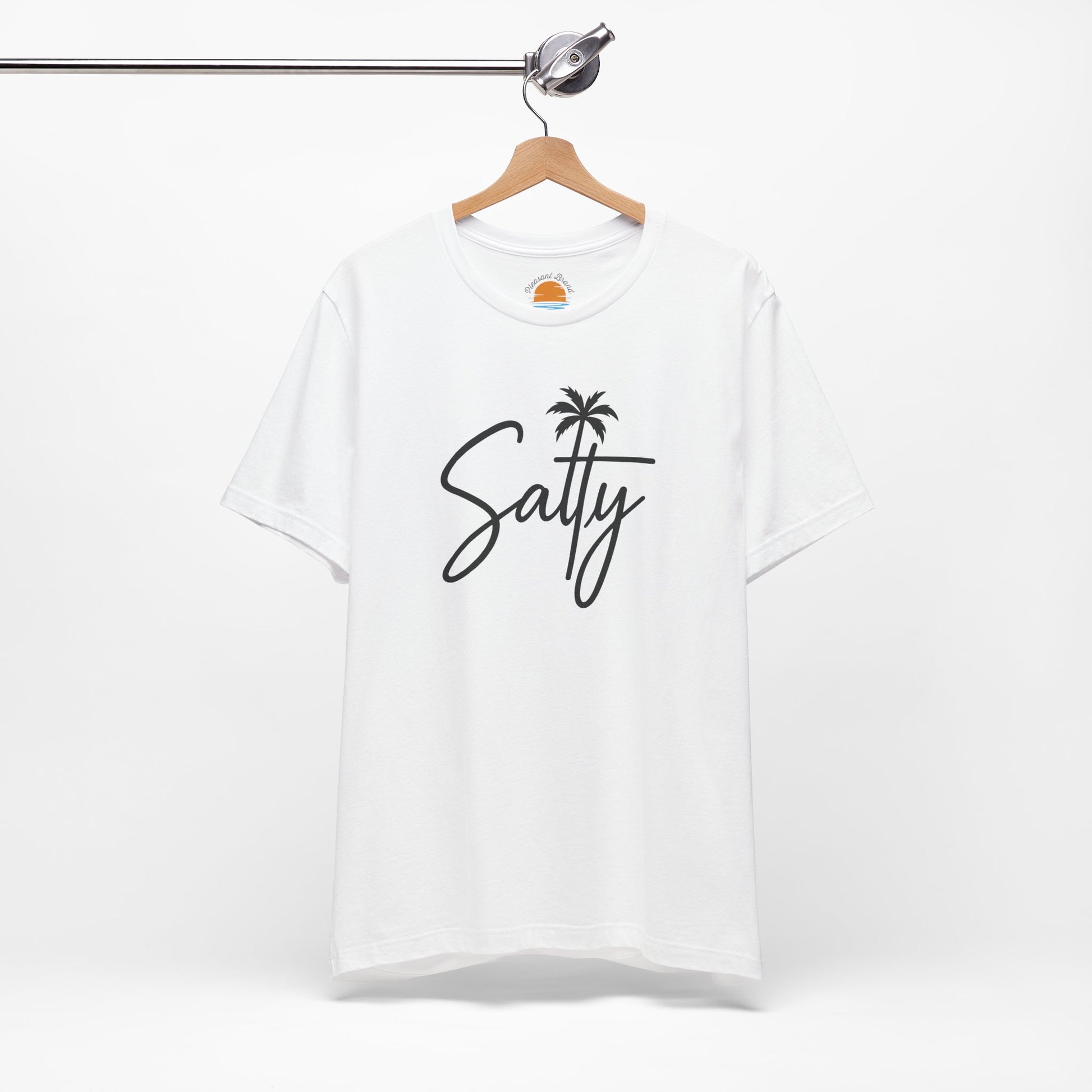 White t-shirt with 'Salty' and a palm tree design on a hanger against a white background