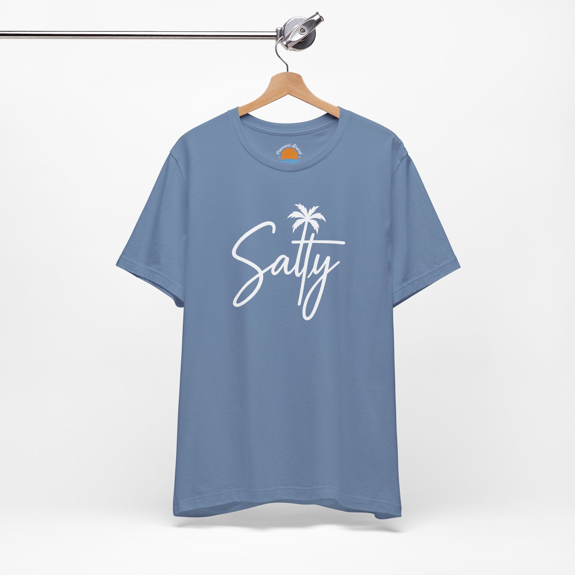 Blue t-shirt with 'Salty' and a palm tree graphic on a hanger against a white background