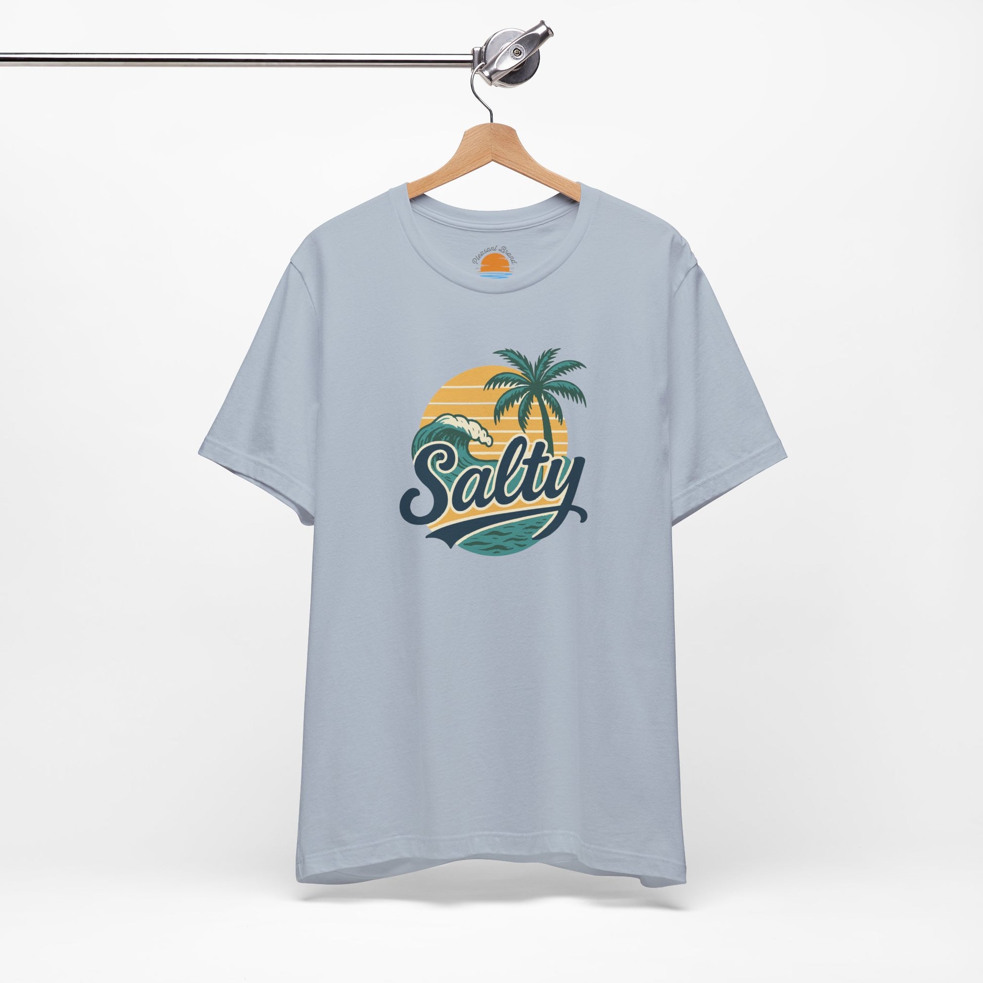 Light blue t-shirt with 'Salty' graphic on a hanger against a white background