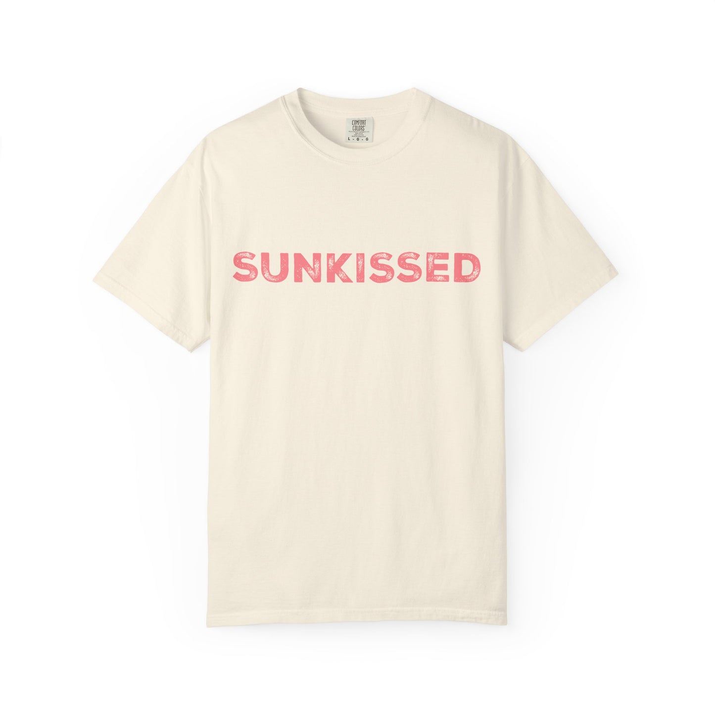 Ivory color Comfort Colors T-shirt with 'Sunkissed'  text in pink on a white background