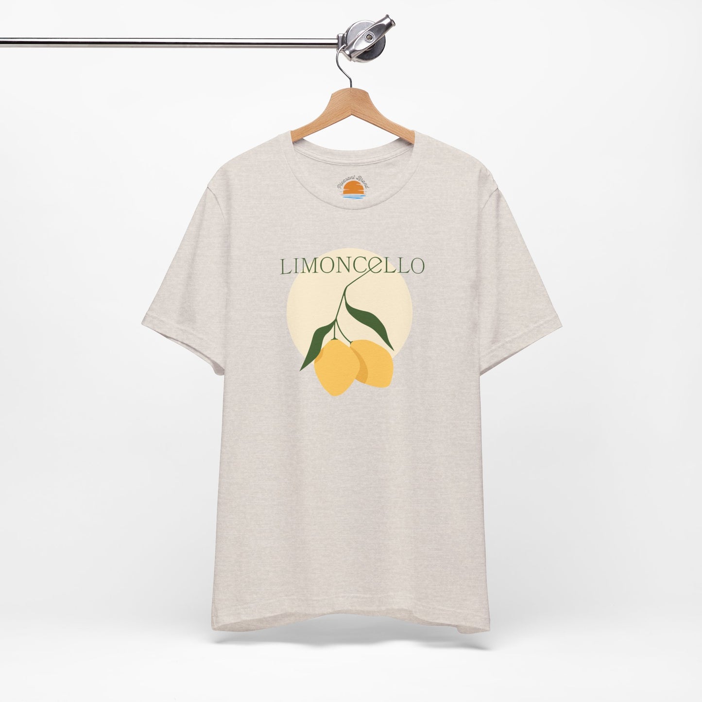 Beige t-shirt with limoncello graphic on a hanger against a white background