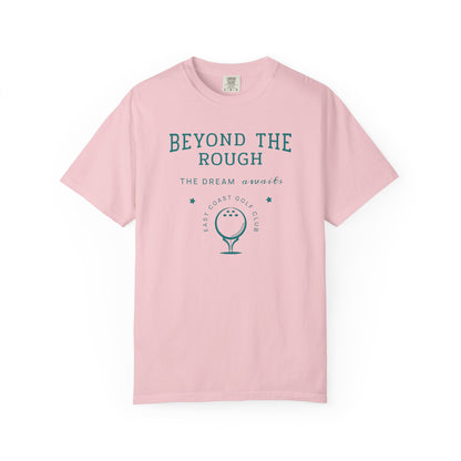 Pink t-shirt with 'Beyond the Rough' text and golf graphic on a white background