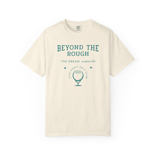Beige t-shirt with 'Beyond the Rough' text and golf graphic on a white background