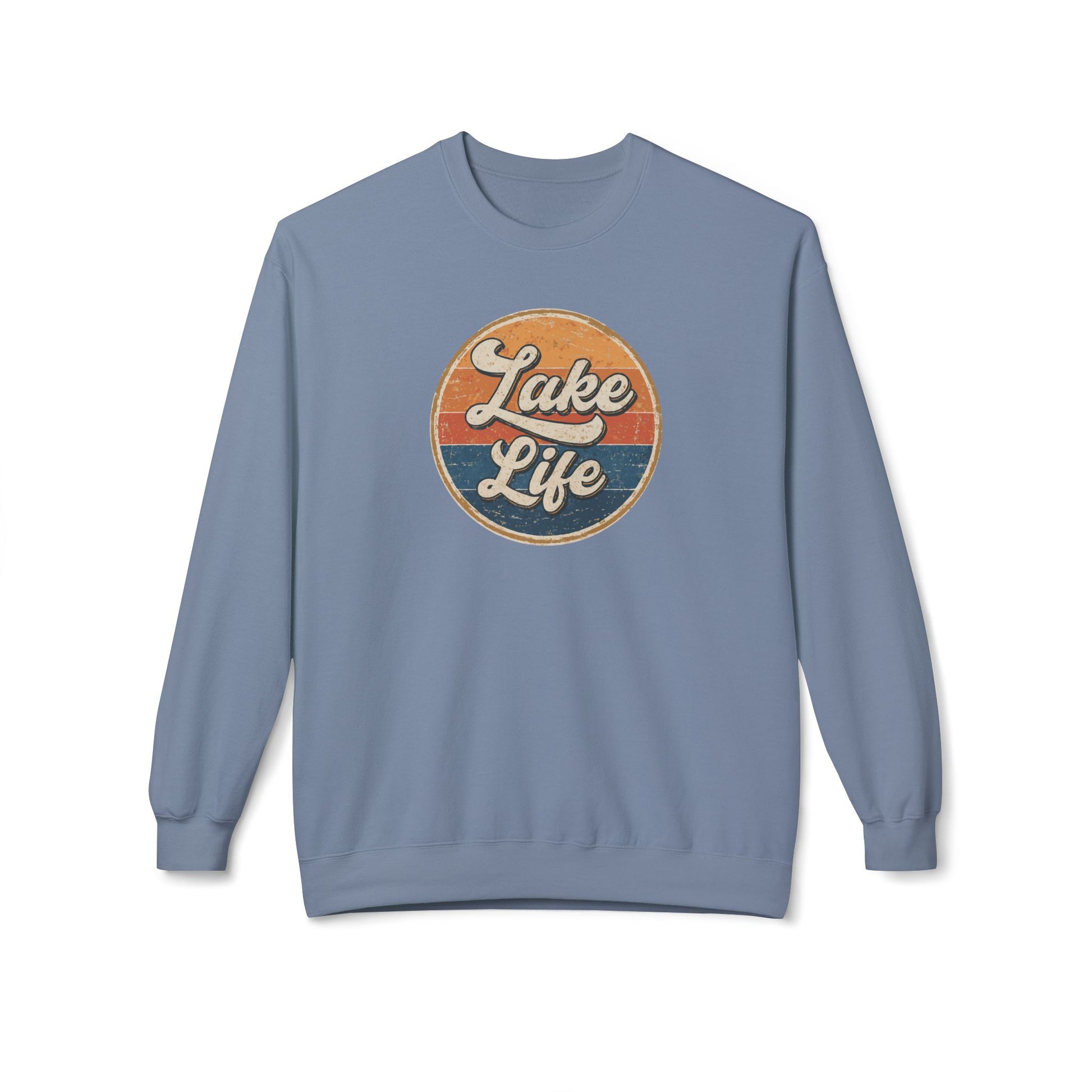 A dusty blue crewneck sweatshirt featuring a circular retro-style graphic on the chest with the words 'Lake Life' in white script over orange and navy blue stripes.