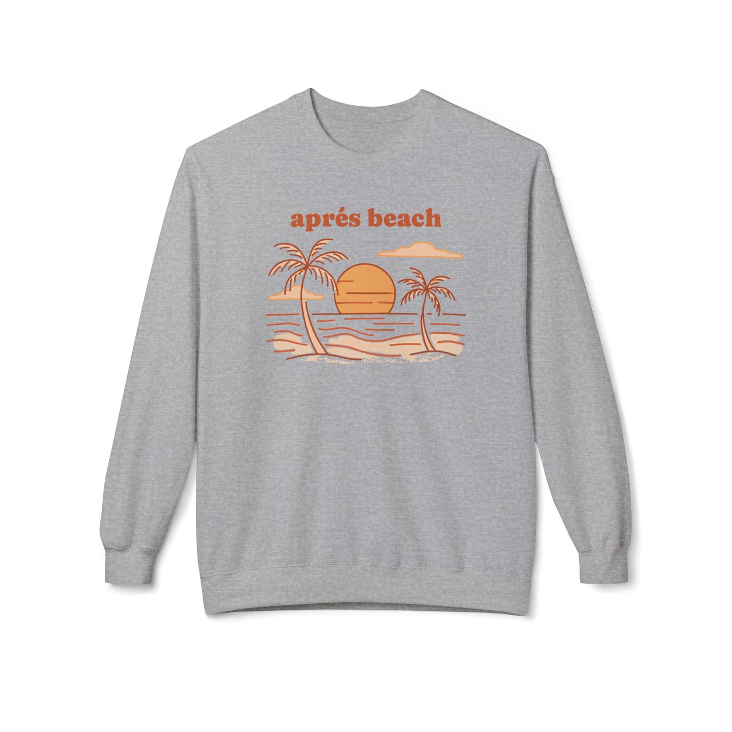 A heather gray crewneck sweatshirt featuring a retro beach graphic with the text 'après beach' in orange above a stylized illustration of palm trees, sand, and water.
