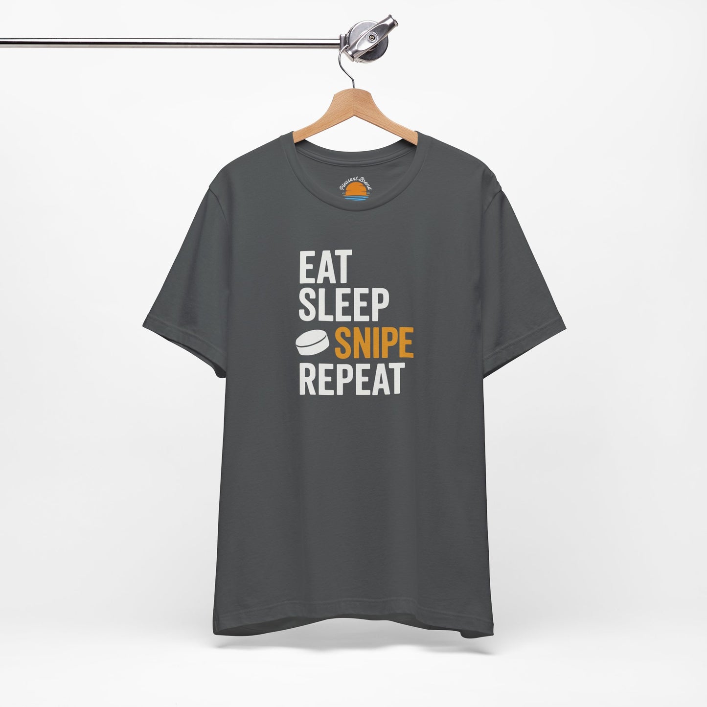 Asphalt t-shirt with 'Eat Sleep Snipe Repeat' text on a hanger against a white background