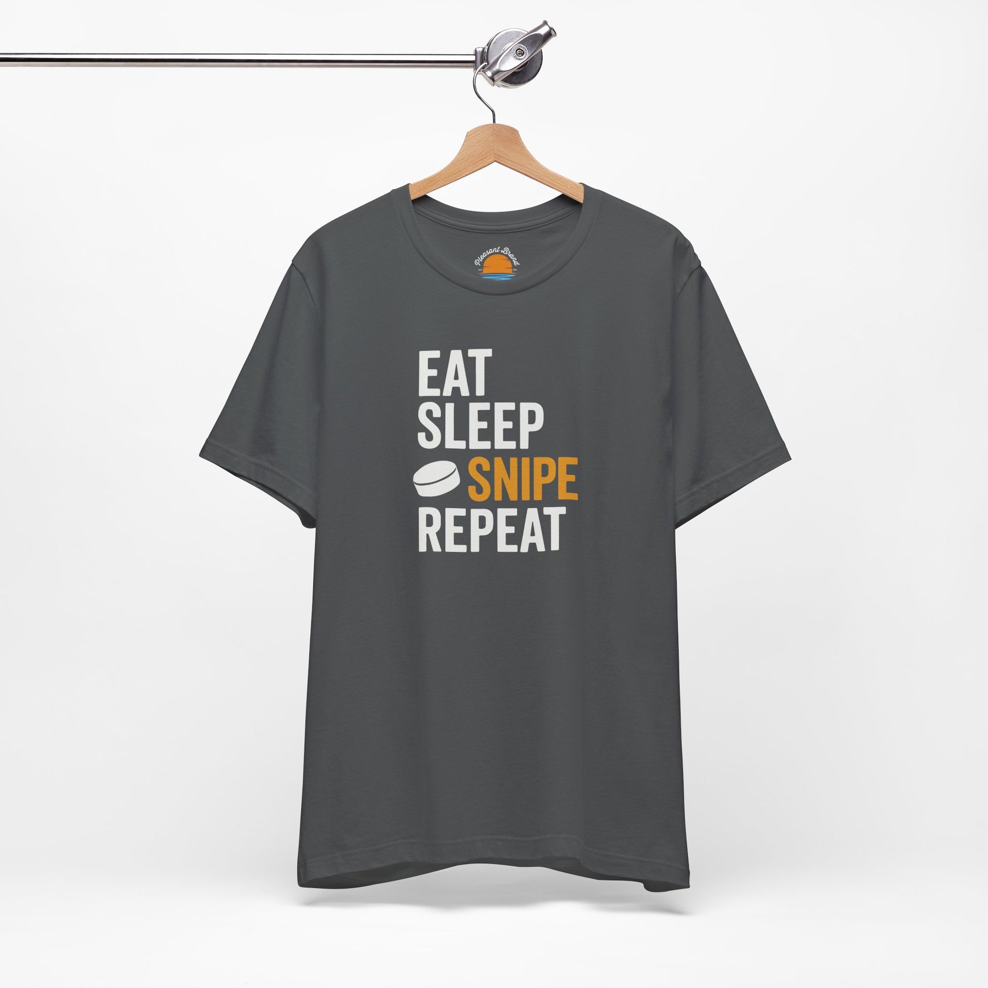 Asphalt t-shirt with 'Eat Sleep Snipe Repeat' text on a hanger against a white background