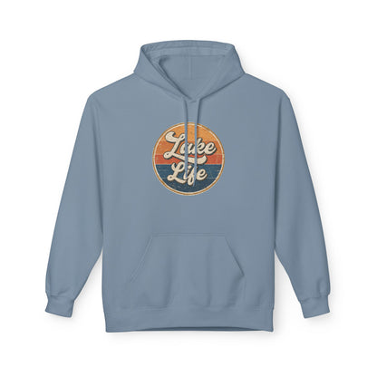 A light blue pullover hoodie with a circular retro-style graphic on the chest reading 'Lake Life' in white script over orange and dark blue horizontal stripes. The hoodie is shown against a plain white background.