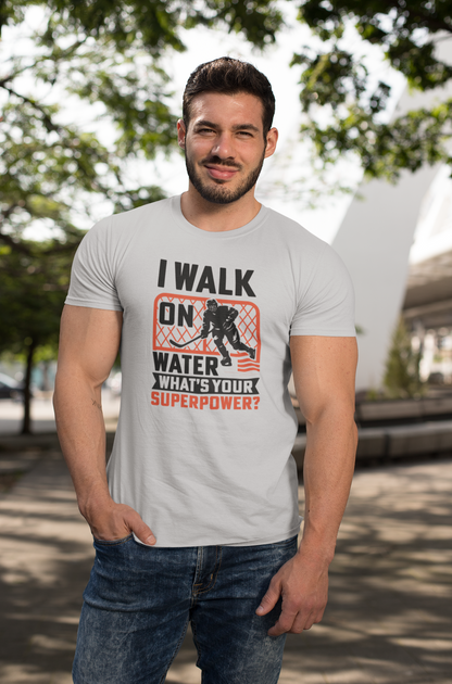 Confident man wearing Walk On Water T-Shirt with superhero hockey messaging in casual outdoor setting