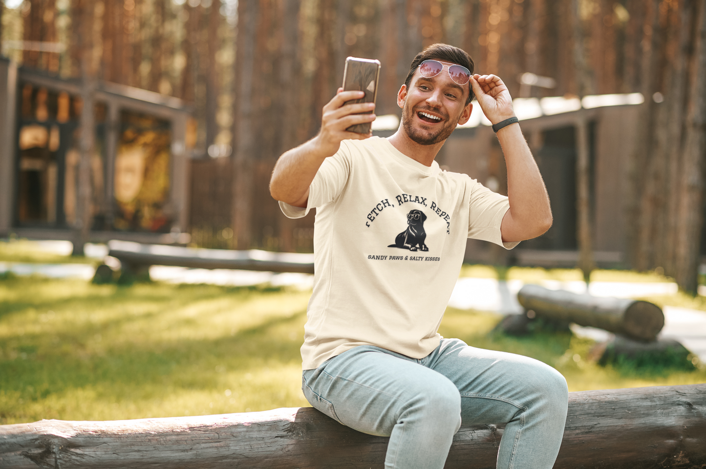 Smiling man wearing Lab in Shades T-Shirt taking selfie outdoors in sunny park setting
