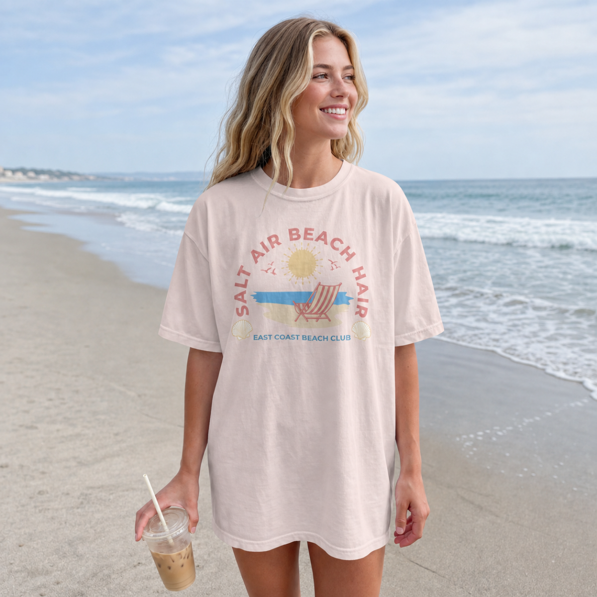 Woman wearing a 'Salt Air Beach Hair' t-shirt on a beach
