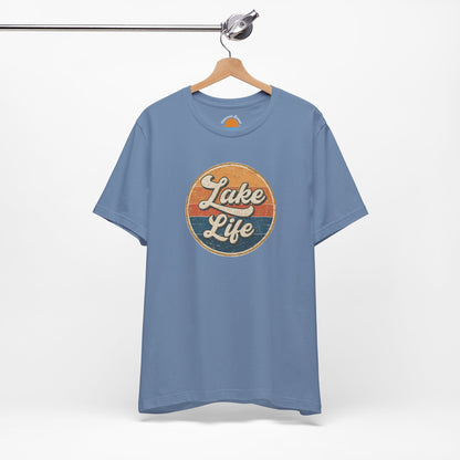 Blue t-shirt with 'Lake Life' graphic on a hanger against a white background