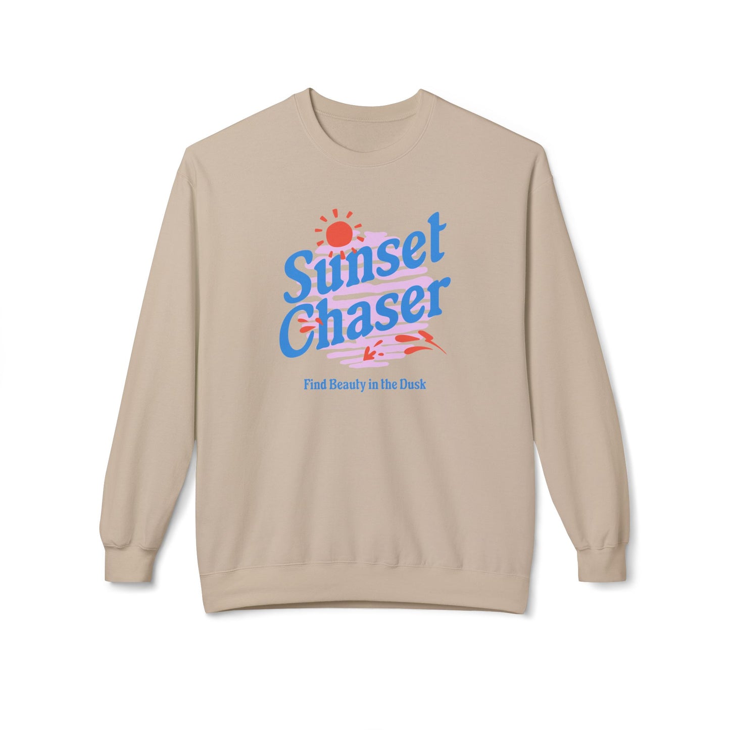 A beige crewneck sweatshirt featuring a retro-style graphic on the chest with the text 'Sunset Chaser' in blue, a red sun, and pink and blue stripes, with the phrase 'Find Beauty in the Dark' printed below.