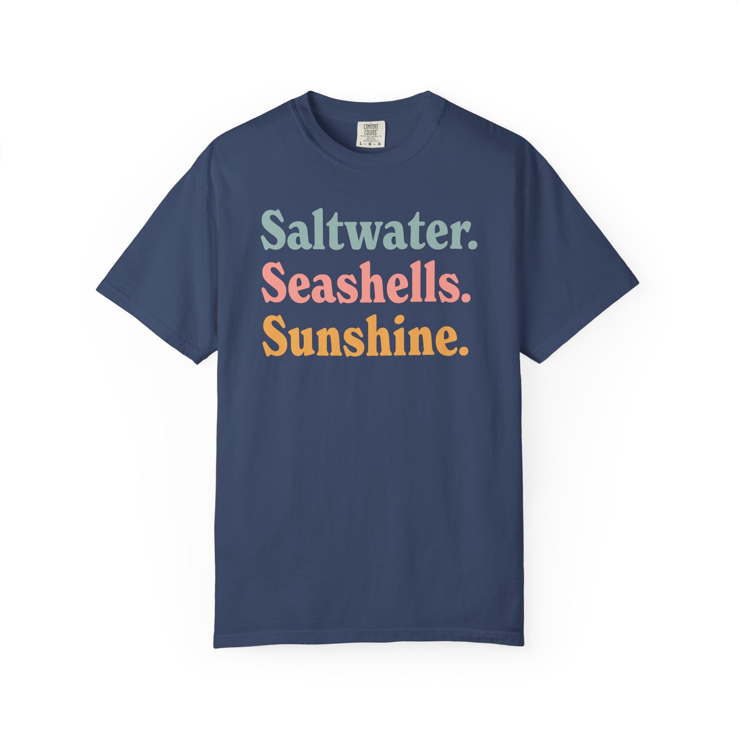 China blue Comfort Colors t-shirt with colorful text 'Saltwater. Seashells. Sunshine.' on a white background