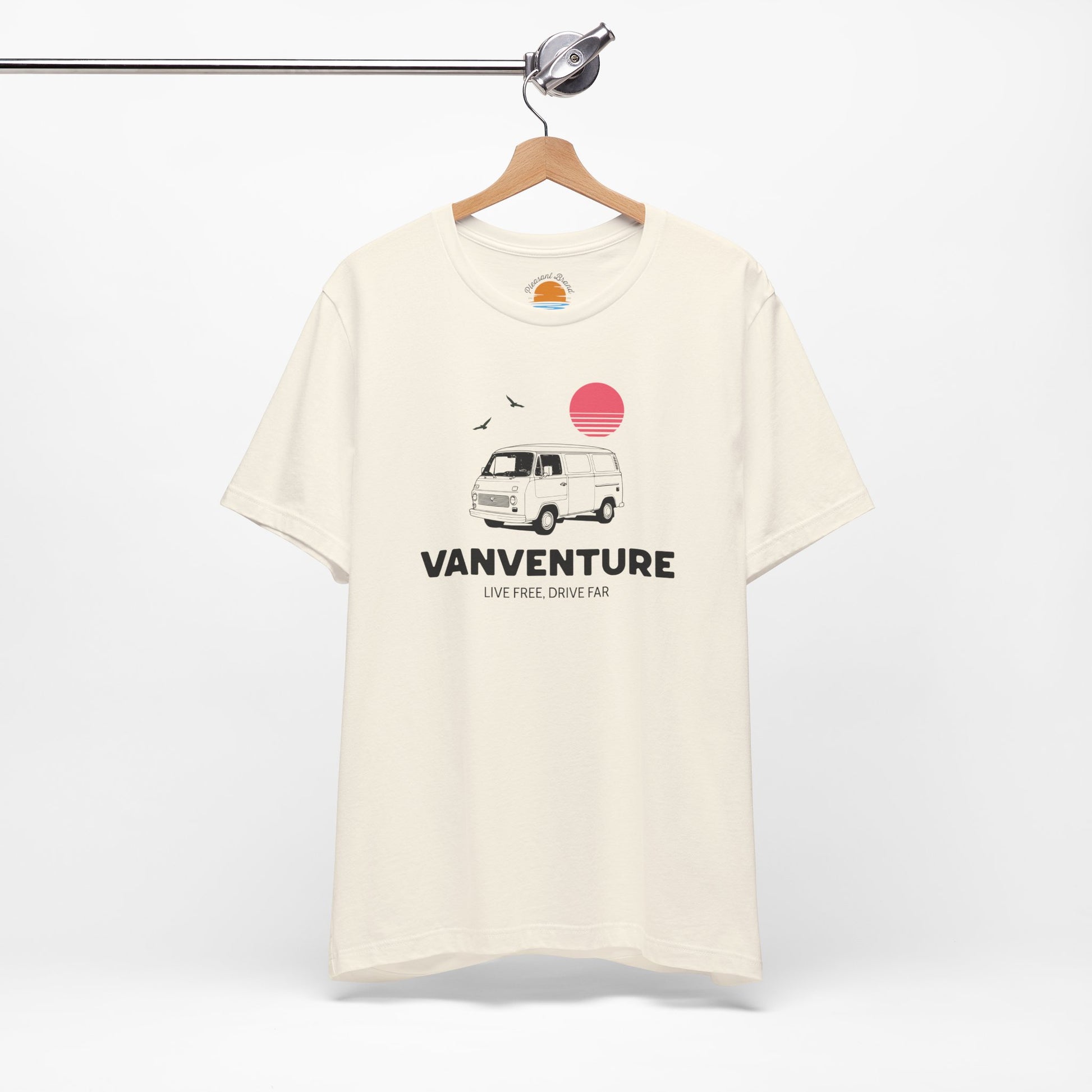 Beige t-shirt with Vanventure graphic on a hanger against a white background