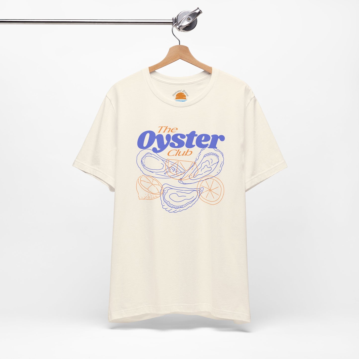 Natural color t-shirt with 'The Oyster Club' graphic on a hanger against a white background