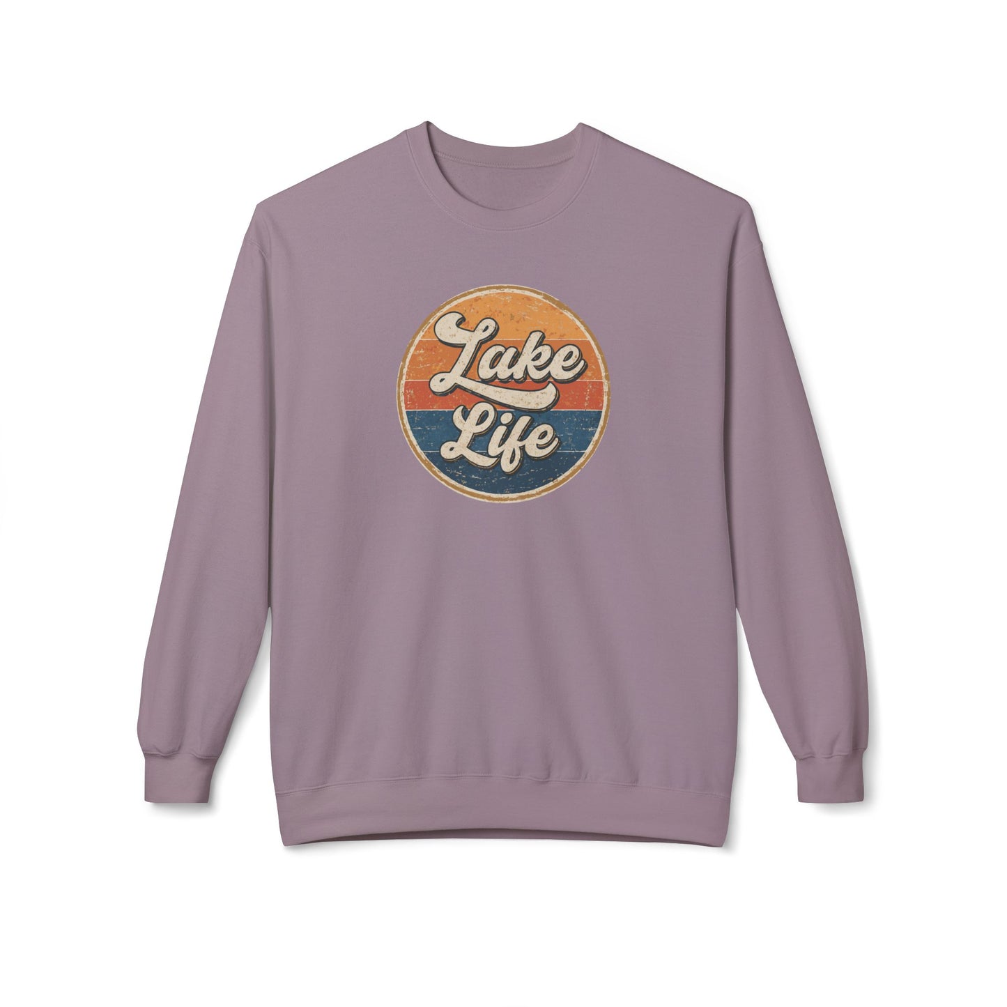 A dusty purple crewneck sweatshirt featuring a retro circular graphic on the chest with the text 'Lake Life' in white script over orange and blue sunset stripes.